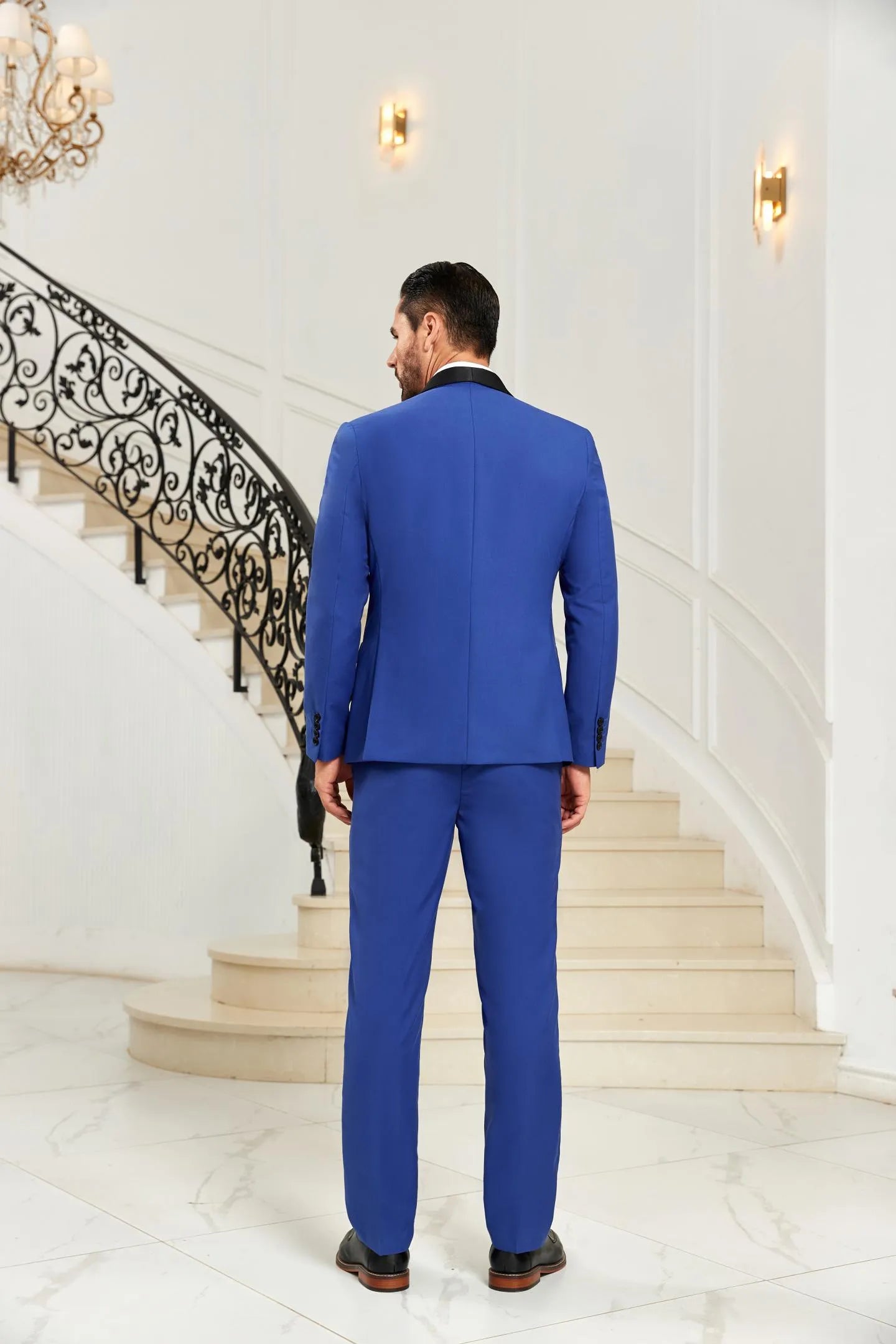 Royal blue shawl collar 3 piece men's suit back view highlighting blazer design and slim fit trousers
